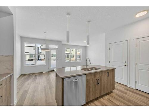 62 Sugarsnap Gardens Se, Calgary, AB - Indoor Photo Showing Kitchen With Double Sink