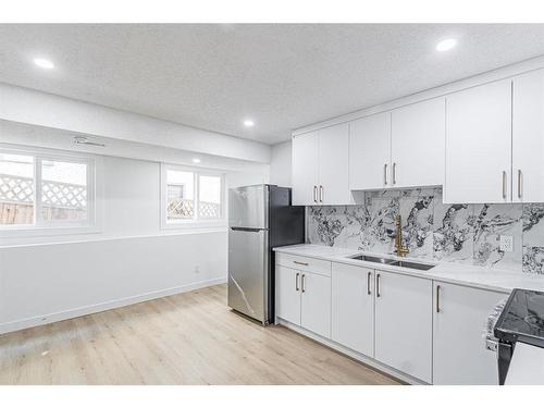 122 Sandstone Drive Nw, Calgary, AB - Indoor Photo Showing Kitchen With Double Sink