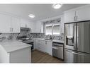 122 Sandstone Drive Nw, Calgary, AB  - Indoor Photo Showing Kitchen With Double Sink 