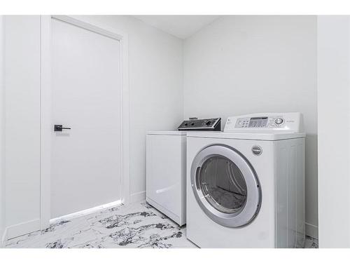 122 Sandstone Drive Nw, Calgary, AB - Indoor Photo Showing Laundry Room