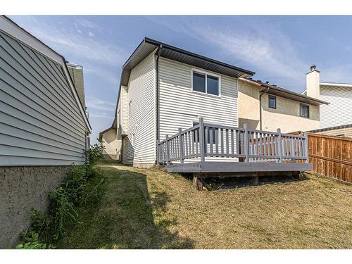 122 Sandstone Drive Nw, Calgary, AB - Outdoor With Deck Patio Veranda With Exterior