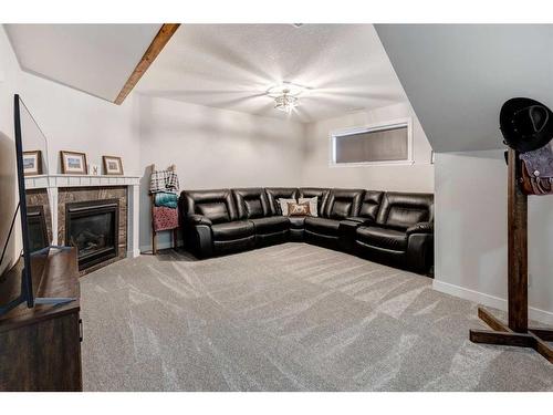 45 Mackenzie Way, Carstairs, AB - Indoor With Fireplace