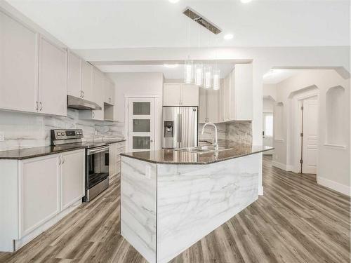 53 Chaparral Ridge Rise Se, Calgary, AB - Indoor Photo Showing Kitchen With Stainless Steel Kitchen With Double Sink With Upgraded Kitchen