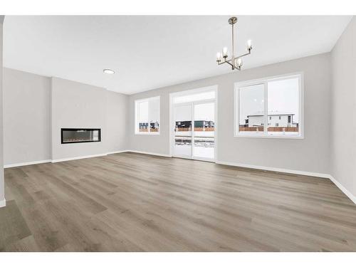 317 Corner Glen Way Ne, Calgary, AB - Indoor Photo Showing Living Room With Fireplace