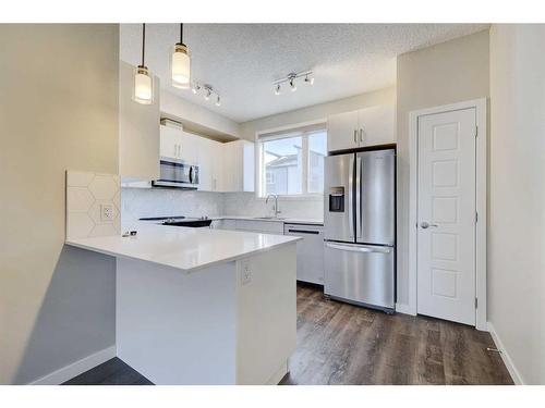 445-301 Redstone Boulevard Ne, Calgary, AB - Indoor Photo Showing Kitchen With Upgraded Kitchen