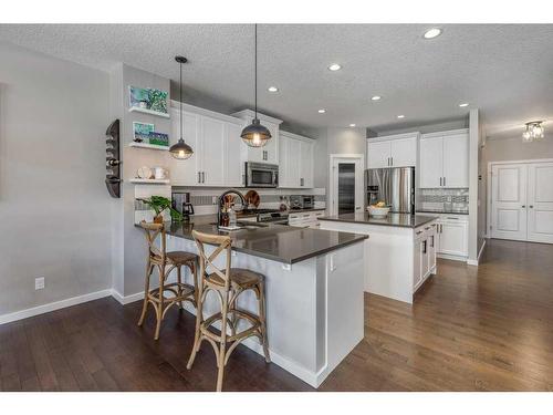 113 Heritage Cove, Cochrane, AB - Indoor Photo Showing Kitchen With Upgraded Kitchen