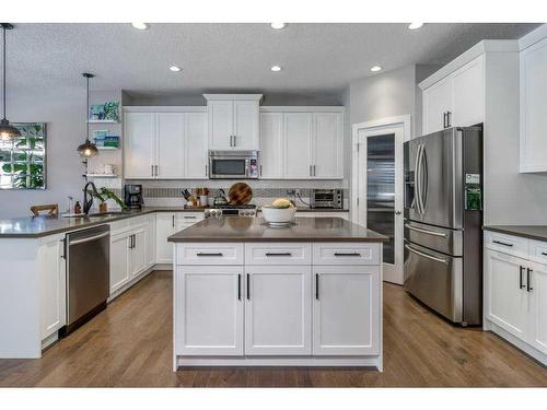 113 Heritage Cove, Cochrane, AB - Indoor Photo Showing Kitchen With Upgraded Kitchen