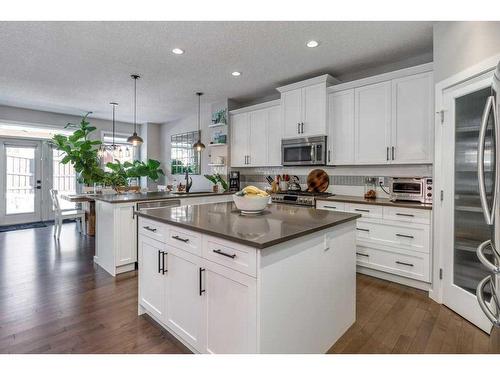 113 Heritage Cove, Cochrane, AB - Indoor Photo Showing Kitchen With Upgraded Kitchen