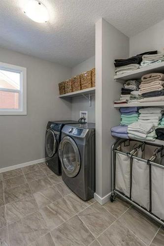 113 Heritage Cove, Cochrane, AB - Indoor Photo Showing Laundry Room