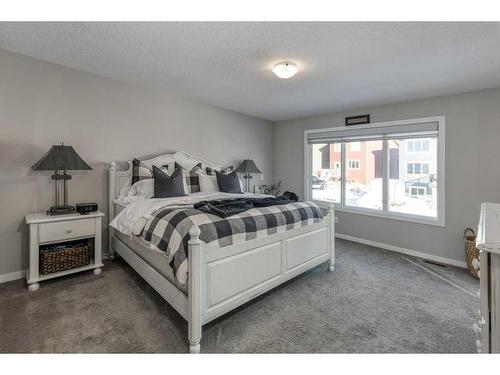 113 Heritage Cove, Cochrane, AB - Indoor Photo Showing Bedroom