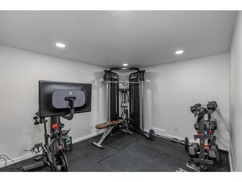 113 Heritage Cove, Cochrane, AB - Indoor Photo Showing Gym Room