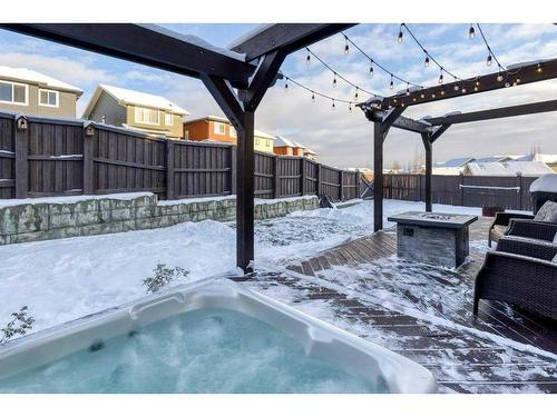 113 Heritage Cove, Cochrane, AB - Outdoor With In Ground Pool