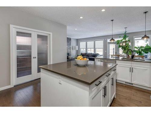 113 Heritage Cove, Cochrane, AB - Indoor Photo Showing Kitchen With Upgraded Kitchen