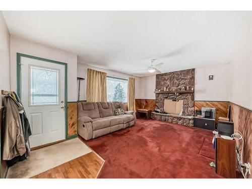 2622 42 Street Se, Calgary, AB - Indoor Photo Showing Living Room With Fireplace