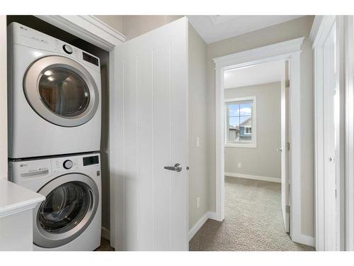 182 Willow Green, Cochrane, AB - Indoor Photo Showing Laundry Room