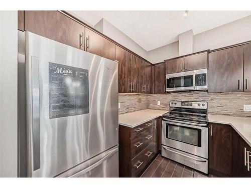 453 Copperpond Landing Se, Calgary, AB - Indoor Photo Showing Kitchen With Stainless Steel Kitchen