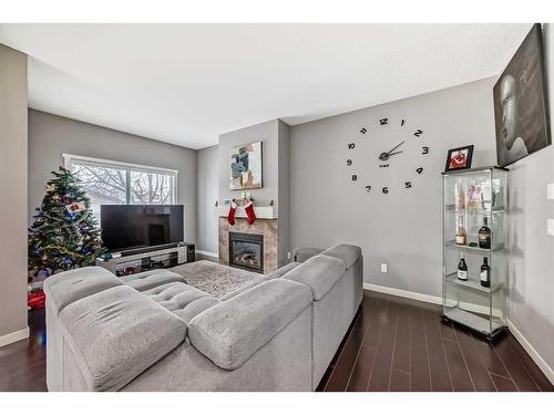 453 Copperpond Landing Se, Calgary, AB - Indoor Photo Showing Living Room With Fireplace