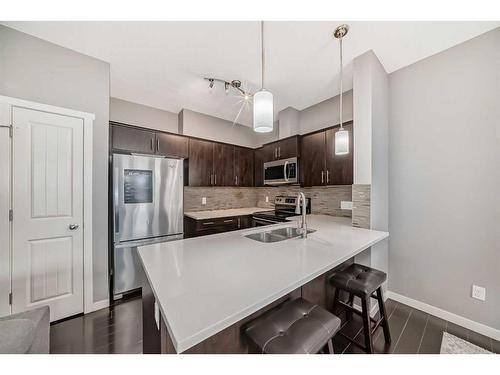 453 Copperpond Landing Se, Calgary, AB - Indoor Photo Showing Kitchen With Stainless Steel Kitchen With Double Sink With Upgraded Kitchen