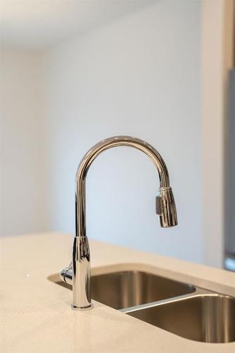 333 Baneberry Way Sw, Airdrie, AB - Indoor Photo Showing Kitchen With Double Sink