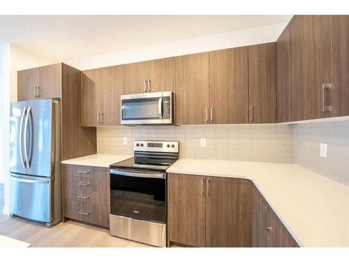 333 Baneberry Way Sw, Airdrie, AB - Indoor Photo Showing Kitchen