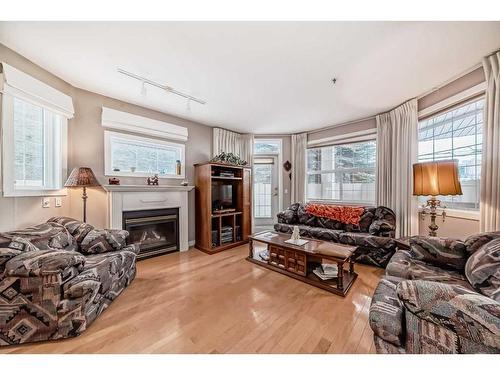 101-3412 Parkdale Boulevard Nw, Calgary, AB - Indoor Photo Showing Living Room With Fireplace