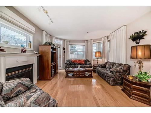 101-3412 Parkdale Boulevard Nw, Calgary, AB - Indoor Photo Showing Living Room With Fireplace