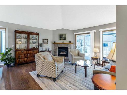 325 De Foras Close Nw, High River, AB - Indoor Photo Showing Living Room With Fireplace