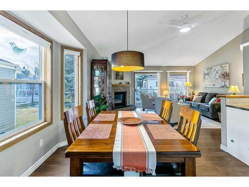 325 De Foras Close Nw, High River, AB - Indoor Photo Showing Dining Room With Fireplace