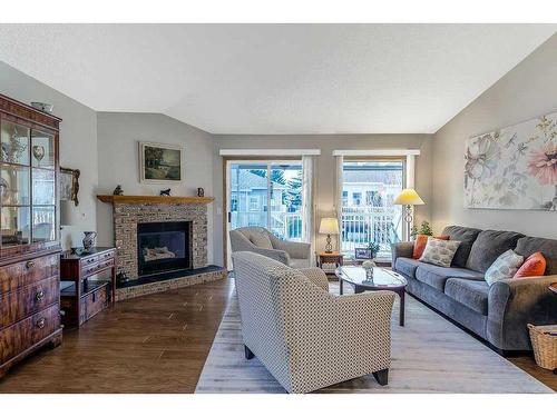 325 De Foras Close Nw, High River, AB - Indoor Photo Showing Living Room With Fireplace