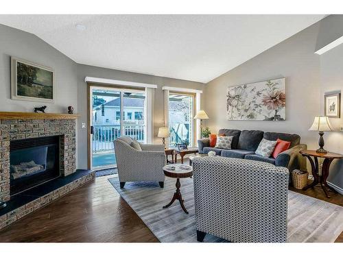 325 De Foras Close Nw, High River, AB - Indoor Photo Showing Living Room With Fireplace