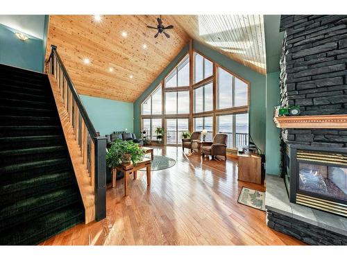 642157 72 Street East, Rural Foothills County, AB - Indoor Photo Showing Other Room With Fireplace