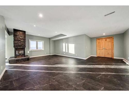 642157 72 Street East, Rural Foothills County, AB - Indoor Photo Showing Other Room With Fireplace