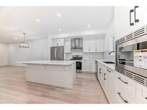 260 Belmont Way Sw, Calgary, AB - Indoor Photo Showing Kitchen With Upgraded Kitchen