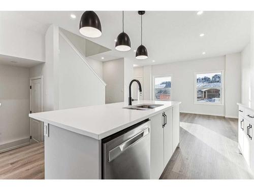 89 Riversong Boulevard, Cochrane, AB - Indoor Photo Showing Kitchen With Double Sink With Upgraded Kitchen