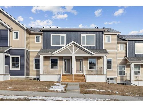 89 Riversong Boulevard, Cochrane, AB - Outdoor With Facade