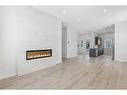 110-595 Mahogany Road Se, Calgary, AB  - Indoor Photo Showing Living Room With Fireplace 