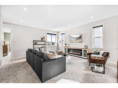 210 Blackstone Road, Balzac, AB - Indoor Photo Showing Living Room With Fireplace