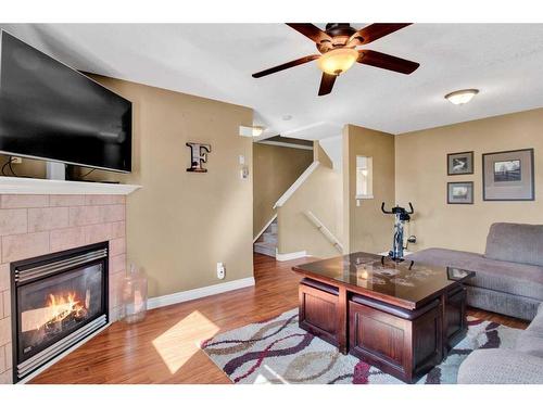 19 Tucker Circle, Okotoks, AB - Indoor Photo Showing Living Room With Fireplace