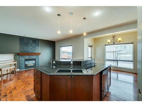 159 Cougarstone Court Sw, Calgary, AB - Indoor Photo Showing Kitchen With Double Sink