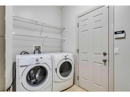 159 Cougarstone Court Sw, Calgary, AB - Indoor Photo Showing Laundry Room