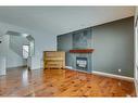 159 Cougarstone Court Sw, Calgary, AB  - Indoor Photo Showing Living Room With Fireplace 