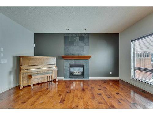 159 Cougarstone Court Sw, Calgary, AB - Indoor With Fireplace