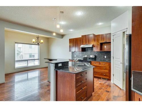 159 Cougarstone Court Sw, Calgary, AB - Indoor Photo Showing Kitchen