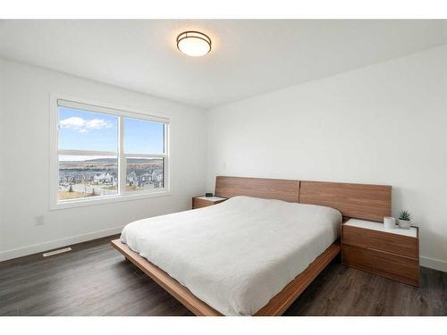 64 Heritage Lane, Cochrane, AB - Indoor Photo Showing Bedroom