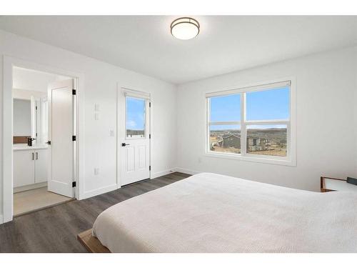 64 Heritage Lane, Cochrane, AB - Indoor Photo Showing Bedroom