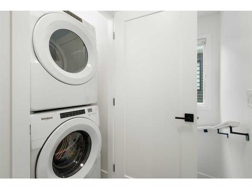 64 Heritage Lane, Cochrane, AB - Indoor Photo Showing Laundry Room