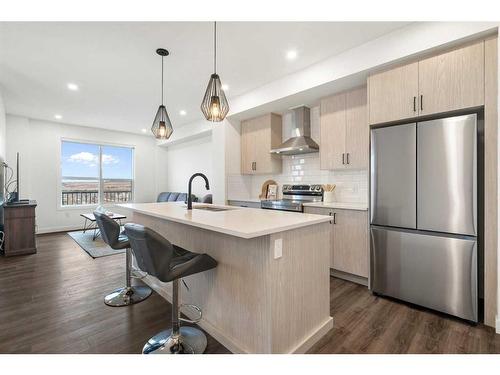 64 Heritage Lane, Cochrane, AB - Indoor Photo Showing Kitchen With Upgraded Kitchen