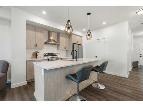 64 Heritage Lane, Cochrane, AB - Indoor Photo Showing Kitchen With Upgraded Kitchen