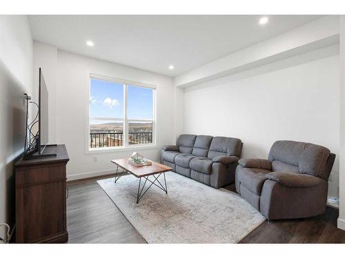 64 Heritage Lane, Cochrane, AB - Indoor Photo Showing Living Room