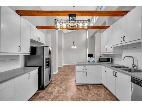 91 Emberdale Way Se, Airdrie, AB - Indoor Photo Showing Kitchen With Double Sink